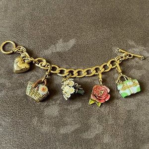 Juicy Couture bracelet with 4 charms.